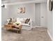 Cozy room featuring a comfortable white couch with accent pillows and coffee table at 2950 Hudson St, Denver, CO 80207