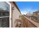 Cozy balcony offers a relaxing outdoor space with views of neighboring properties and open sky at 7700 W Glasgow Pl # 11C, Littleton, CO 80128