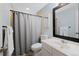 Bathroom featuring shower with gray curtain, vanity with white counter, and framed mirror at 7700 W Glasgow Pl # 11C, Littleton, CO 80128