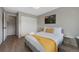 Cozy bedroom with neutral walls, a comfortable bed, and ample closet space for convenient storage at 7700 W Glasgow Pl # 11C, Littleton, CO 80128