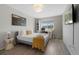 Bright bedroom features natural light, mountain view, and a modern desk area perfect for work or study at 7700 W Glasgow Pl # 11C, Littleton, CO 80128