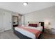 Bedroom with modern decor, featuring natural light, and views of the green landscape and trees at 7700 W Glasgow Pl # 11C, Littleton, CO 80128