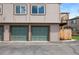 Attached garages provide convenient parking and easy access to the property, with upper level balcony at 7700 W Glasgow Pl # 11C, Littleton, CO 80128