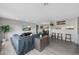 Inviting living room with an open layout, connecting to the dining area and kitchen at 7700 W Glasgow Pl # 11C, Littleton, CO 80128