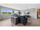 Bright living room with hardwood floors and two large windows offering outdoor views at 7700 W Glasgow Pl # 11C, Littleton, CO 80128