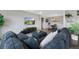 Comfortable living room with sectional couch, hardwood floors and open layout at 7700 W Glasgow Pl # 11C, Littleton, CO 80128