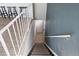 Carpeted staircase with white railing and painted accent wall at 7700 W Glasgow Pl # 11C, Littleton, CO 80128