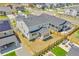 Aerial view showcasing the home's backyard, patio area, and fence, surrounded by lush greenery at 3888 Grand Baker St, Aurora, CO 80019