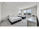Bedroom with neutral carpet, multiple windows, and space for two beds at 3888 Grand Baker St, Aurora, CO 80019