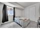 Comfortable bedroom featuring a cozy bed, natural light, and closet at 3888 Grand Baker St, Aurora, CO 80019