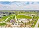 Beautifully landscaped community park with walking paths, open green spaces, and mature trees at 3888 Grand Baker St, Aurora, CO 80019