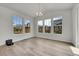 Dining Room featuring a modern chandelier and three large windows offering lots of natural light at 3888 Grand Baker St, Aurora, CO 80019