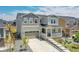 Charming two-story home boasts a welcoming front porch, well-manicured landscaping, and a two-car garage at 3888 Grand Baker St, Aurora, CO 80019