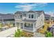 Beautiful two-story home with a covered front porch, two-car garage, and low maintenance landscaping at 3888 Grand Baker St, Aurora, CO 80019