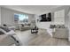 Bright living room with modern furniture, large windows, and neutral tones create an inviting space at 3888 Grand Baker St, Aurora, CO 80019