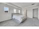 Bright main bedroom with a tray ceiling, carpet flooring, and an ensuite bathroom and walk-in closet at 3888 Grand Baker St, Aurora, CO 80019