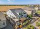 Aerial view of backyard featuring a large patio, pergola, outdoor seating and a grass space at 14066 Ivanhoe Ct, Thornton, CO 80602