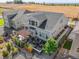 Aerial shot of landscaped backyard featuring a pergola, patio, fire pit, and fenced perimeter at 14066 Ivanhoe Ct, Thornton, CO 80602