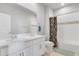 Bathroom features double vanity, large mirror, and shower/tub combo at 14066 Ivanhoe Ct, Thornton, CO 80602