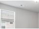 Bright bedroom showcases natural light from a window and neutral wall color at 14066 Ivanhoe Ct, Thornton, CO 80602
