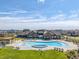 Stunning community pool with ample lounge chairs and a splash pad for Gathering enjoyment at 14066 Ivanhoe Ct, Thornton, CO 80602