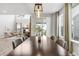 An open dining room showcases the spacious layout and decor, with a living room view at 14066 Ivanhoe Ct, Thornton, CO 80602