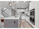 Modern kitchen featuring a large island, stainless steel appliances, and sleek cabinetry at 14066 Ivanhoe Ct, Thornton, CO 80602