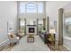 Bright living room offers high ceilings, neutral colors, fireplace, and lots of natural light at 14066 Ivanhoe Ct, Thornton, CO 80602