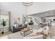Spacious, open-concept living room showcases dining area, kitchen, and a cozy seating area at 14066 Ivanhoe Ct, Thornton, CO 80602