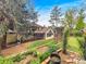Expansive backyard with a covered patio, manicured lawn, established garden beds, putting green and beautiful landscaping at 7217 S Zephyr Way, Littleton, CO 80128