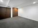 This carpeted basement features a large closet at 7217 S Zephyr Way, Littleton, CO 80128