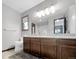 Bathroom with a double vanity, plush rug and a toilet at 7217 S Zephyr Way, Littleton, CO 80128