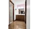 Bathroom features a vanity, wood floors and a shower behind a glass wall at 7217 S Zephyr Way, Littleton, CO 80128
