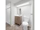 This bathroom features a glass enclosed shower and neutral vanity at 7217 S Zephyr Way, Littleton, CO 80128