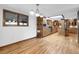View of a kitchen with light wood floors, wood cabinets, modern appliances, and a breakfast bar at 7217 S Zephyr Way, Littleton, CO 80128
