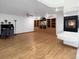 Open living room featuring hardwood floors, a built-in media center, recessed lighting and modern fireplace at 7217 S Zephyr Way, Littleton, CO 80128