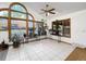 Bright sunroom featuring tiled floors, lots of natural light, and multiple plant fixtures at 7217 S Zephyr Way, Littleton, CO 80128