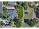 Aerial view of home showing fenced backyard, patio, deck, and surrounding trees, offering privacy and tranquility at 5275 Pinyon Jay Rd, Parker, CO 80134