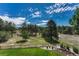 Expansive backyard features lush lawn, rock garden, and a split rail fence, perfect for enjoying the outdoors at 5275 Pinyon Jay Rd, Parker, CO 80134