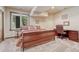 Relaxing bedroom features carpeted floors, a queen-sized bed, and a window with outside view at 5275 Pinyon Jay Rd, Parker, CO 80134