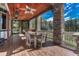 Charming covered deck offers ample seating and scenic views, ideal for relaxing and enjoying the outdoors at 5275 Pinyon Jay Rd, Parker, CO 80134