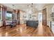 Spacious kitchen with a large island, stainless steel appliances, and hardwood floors at 5275 Pinyon Jay Rd, Parker, CO 80134