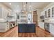 Gourmet kitchen with a marble island, professional grade appliances, and ample cabinet space at 5275 Pinyon Jay Rd, Parker, CO 80134