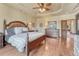 Luxurious main bedroom with a large bed, hardwood floors, and elegant decor at 5275 Pinyon Jay Rd, Parker, CO 80134