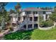 Multi-story home featuring balconies, stone pillars, a spacious yard, and scenic views at 5275 Pinyon Jay Rd, Parker, CO 80134