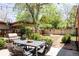 Cozy backyard with patio, grill, and string lights for outdoor entertaining at 650 Kearney St, Denver, CO 80220