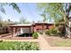 Backyard featuring a patio, garden plots, and access to the main home at 650 Kearney St, Denver, CO 80220