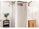 Bright bathroom featuring a stand-up shower, vanity with wood cabinets, and modern fixtures at 650 Kearney St, Denver, CO 80220