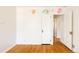 Empty bedroom featuring hardwood floors and unique wall decor at 650 Kearney St, Denver, CO 80220