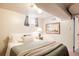 Cozy bedroom featuring soft bedding, natural light, and simple decor creating a peaceful atmosphere at 650 Kearney St, Denver, CO 80220